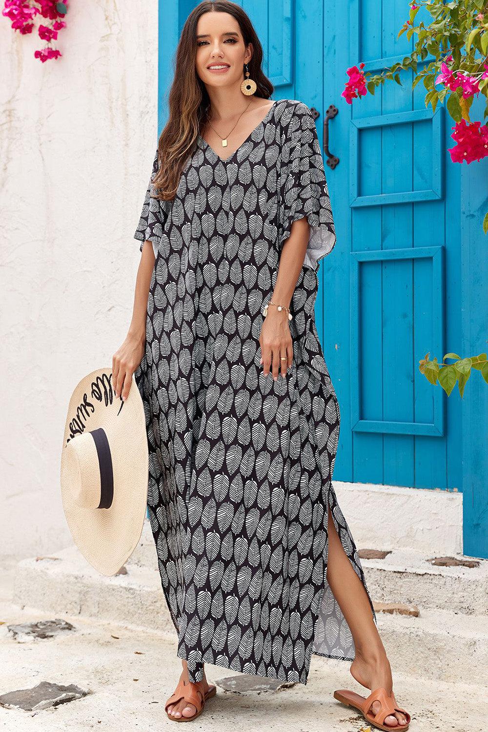 a woman in a black and white dress is holding a hat