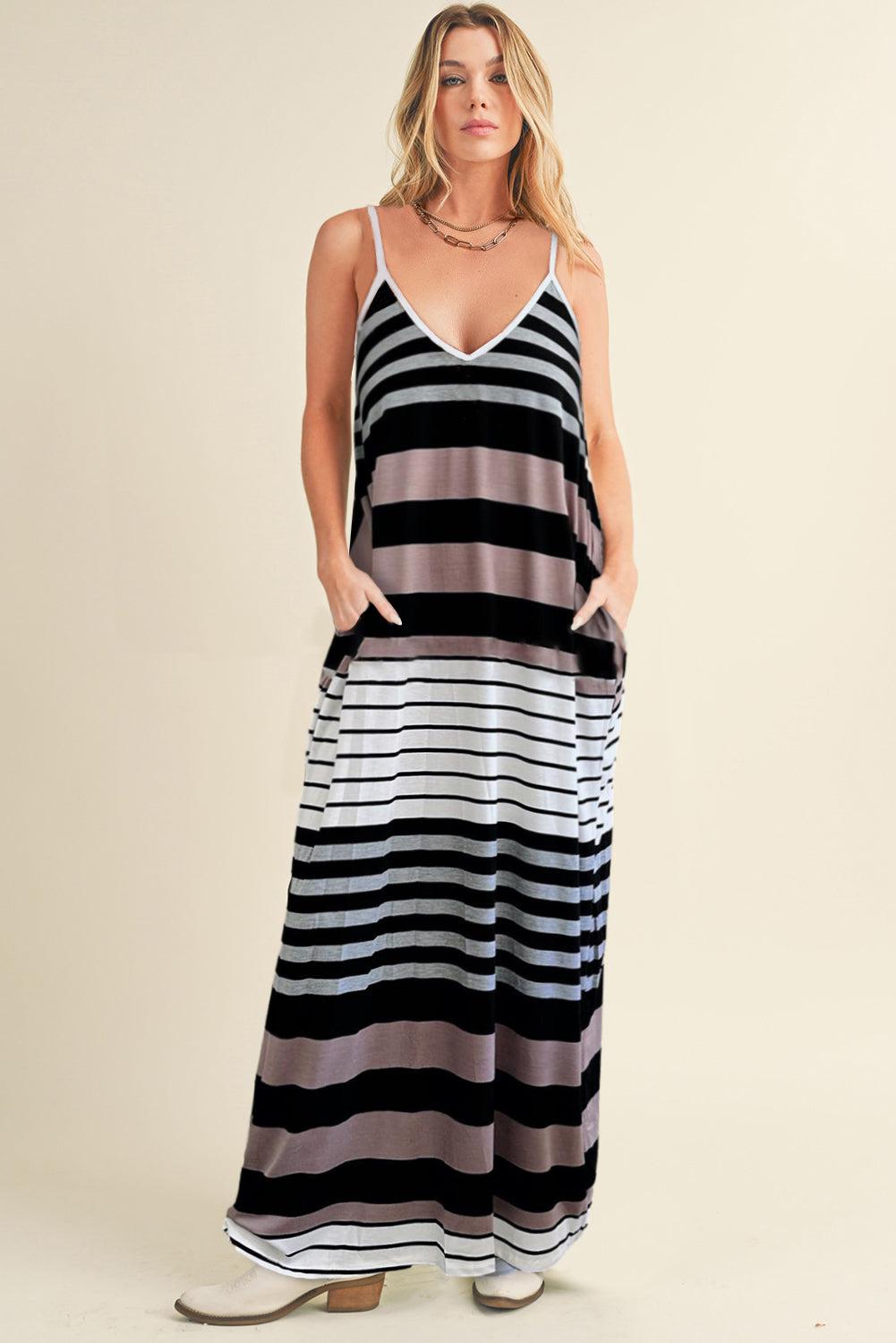 a woman wearing a black and white striped dress