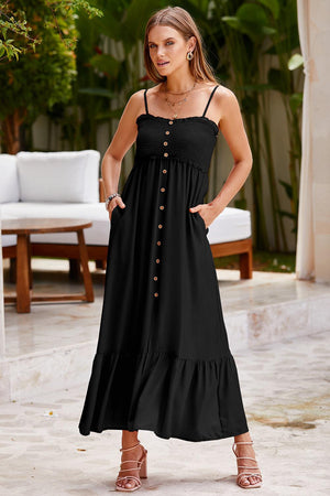 a woman wearing a black dress and sandals