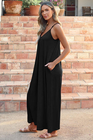 a woman in a black dress standing in front of some steps