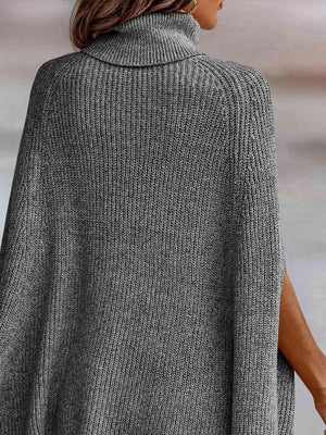 a woman wearing a grey turtle neck sweater