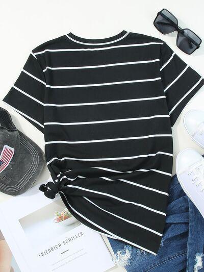 a women's black and white striped top with a hat, sunglasses, and