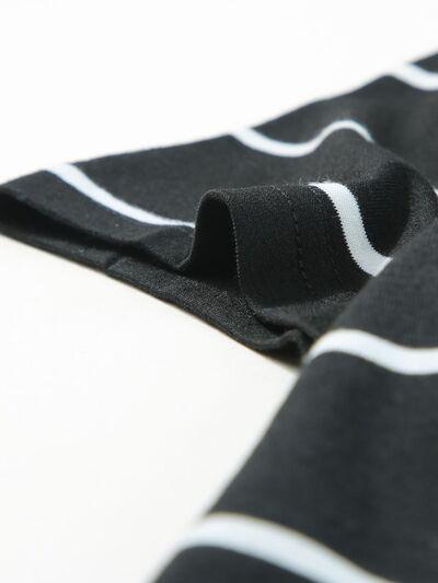 a close up of a black and white scarf