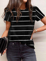 a woman wearing a black and white striped shirt