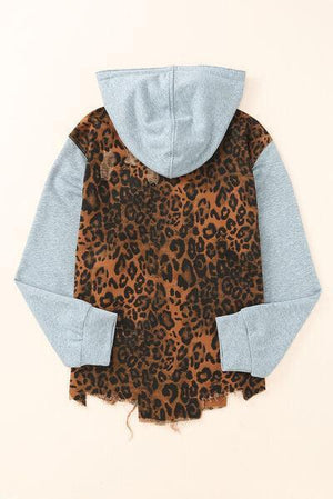 a child's jacket with a leopard print on it