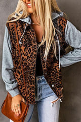 a woman wearing a leopard print jacket and jeans