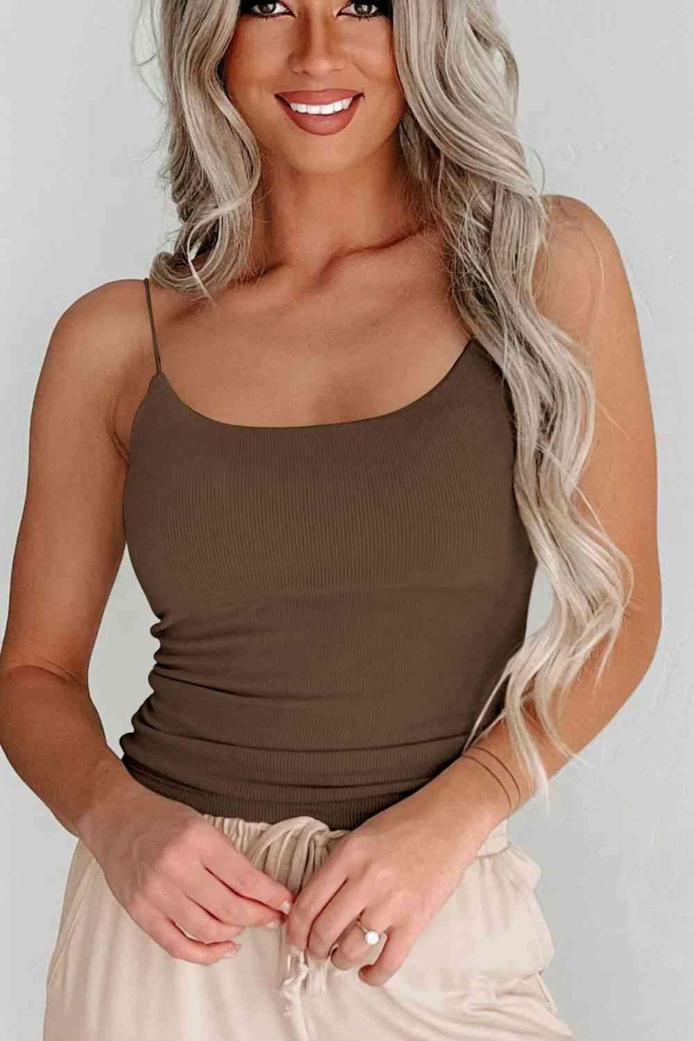 a woman wearing a brown tank top