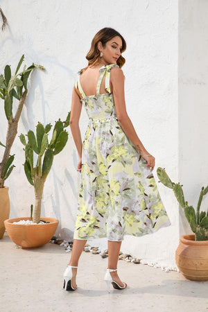 a woman standing in front of a cactus