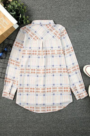 a white shirt with a blue and orange checkered pattern