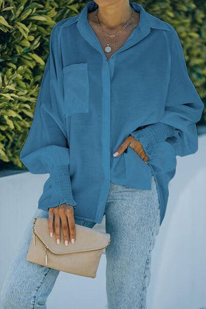 a woman wearing a blue shirt and jeans