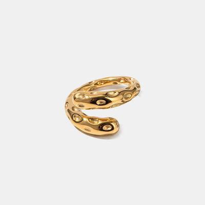 a gold ring on a white background