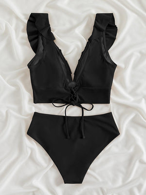 a black bikinisuit with a bow on the side