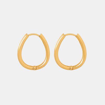 a pair of gold hoop earrings on a white background