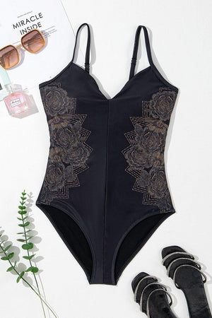 a woman's swimsuit with a pair of black sandals