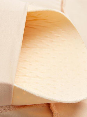 a close up of a mattress with a white cover
