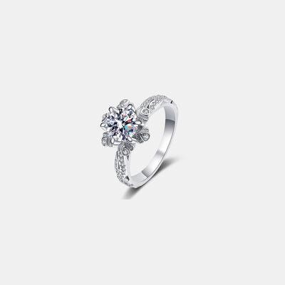 a white gold ring with a flower design