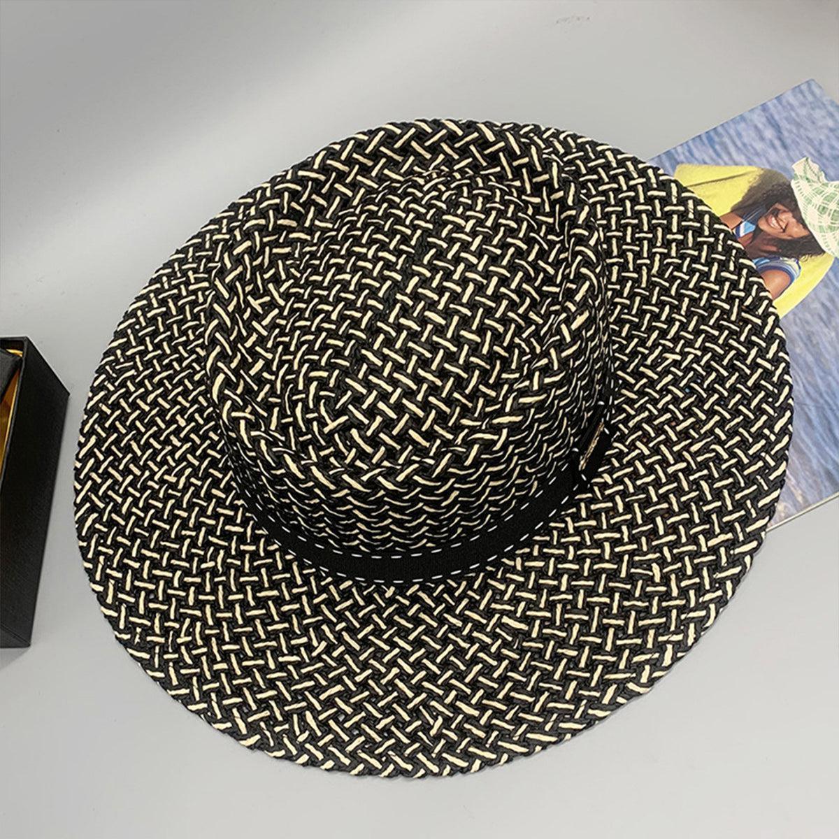 a black and white hat sitting on top of a table