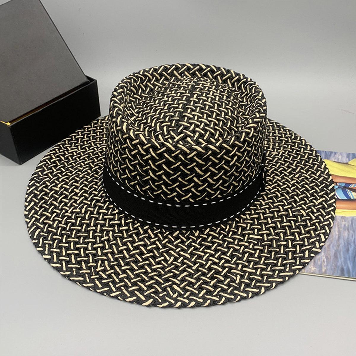 a hat sitting on top of a table next to a box
