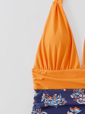 a bathing suit with an orange top and blue bottom