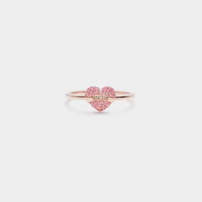 a pink heart shaped ring with two hearts on it