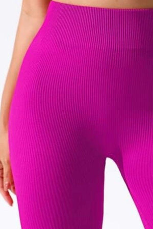 a close up of a woman's butt in a pink sports bra