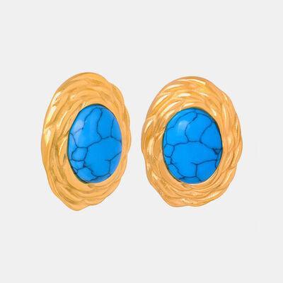 a pair of gold and turquoise stone earrings