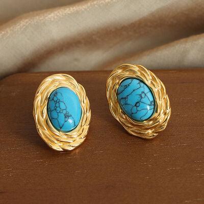 a pair of gold and turquoise stone earrings