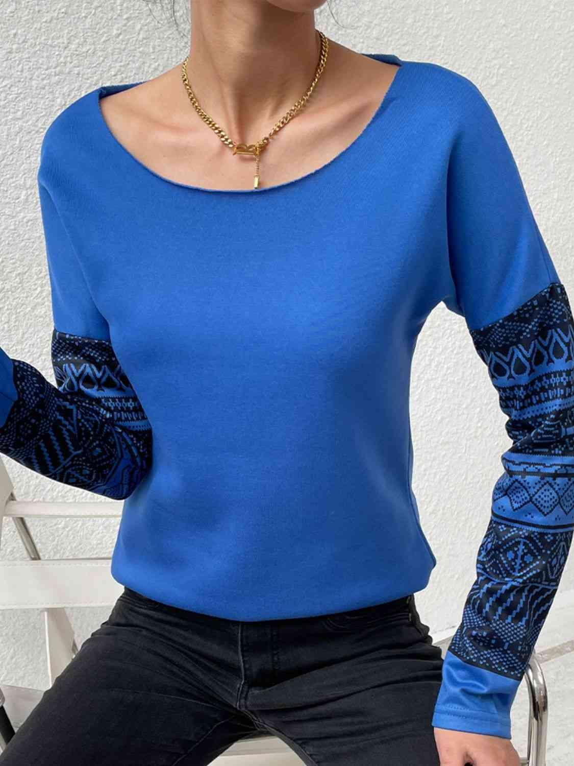 a woman wearing a blue shirt and black pants