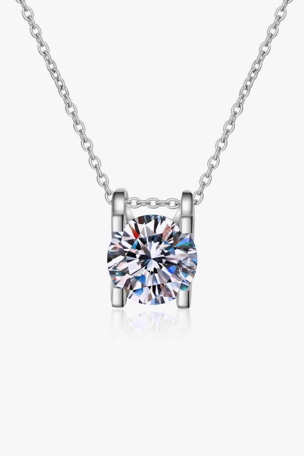 a necklace with a cubic stone in the center
