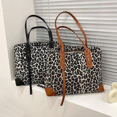 a pair of leopard print handbags sitting on a window sill