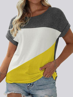 a woman wearing a yellow and grey top