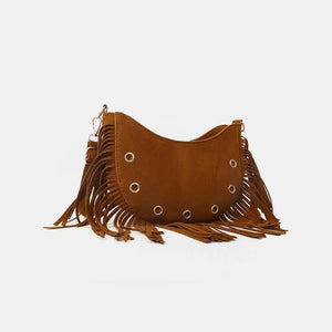 a brown purse with fringes on the side