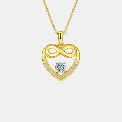 a heart shaped pendant with a diamond in the center