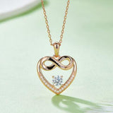 a heart shaped pendant with a diamond in the center