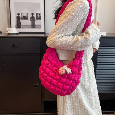 a woman in a white dress holding a pink purse