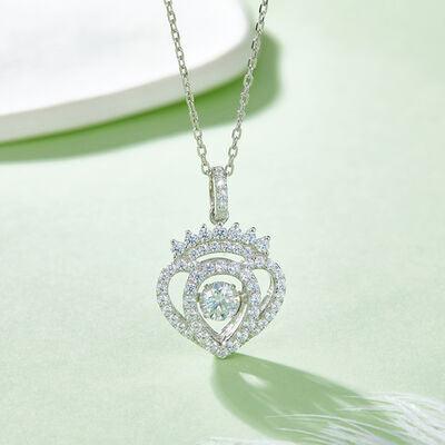 a diamond necklace on a green surface