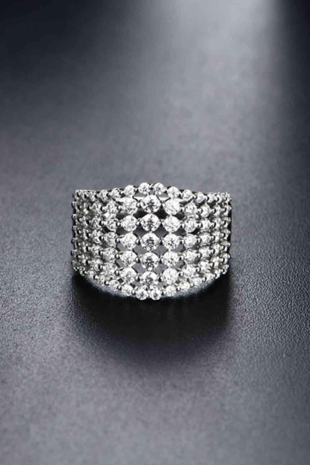 a diamond ring sitting on top of a table