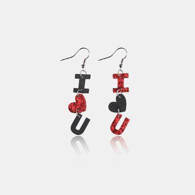 a pair of earrings with the word i love you