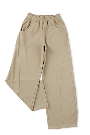 a pair of beige pants on a white background