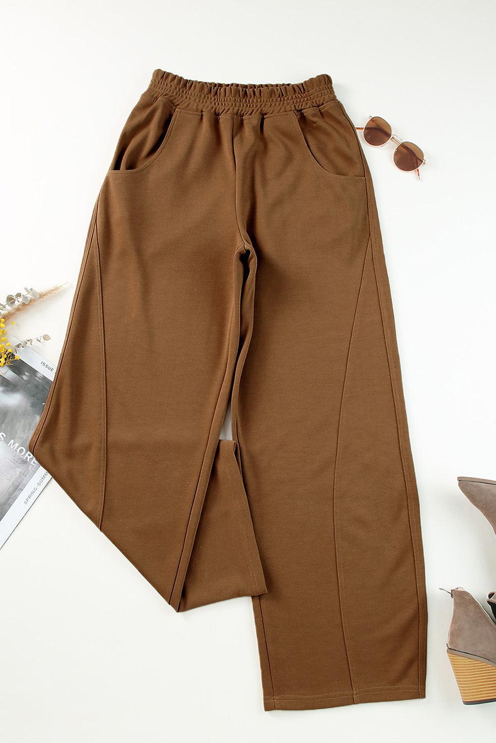 a pair of brown pants sitting on top of a table