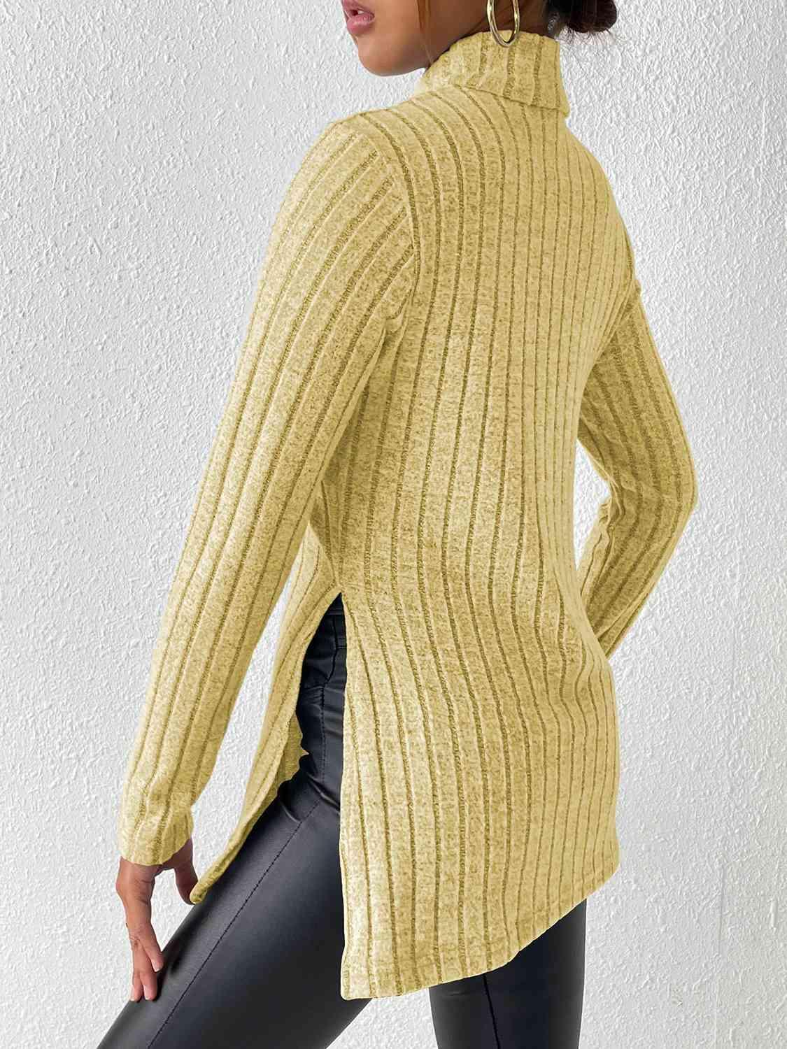 a woman wearing a yellow sweater and black leggings