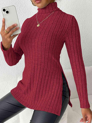 a woman in a red sweater holding a cell phone