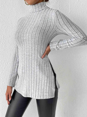 a woman wearing a turtle neck sweater and leggings