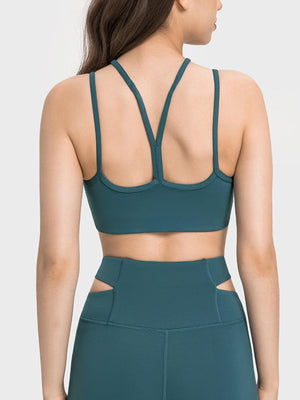 a woman wearing a green sports bra top