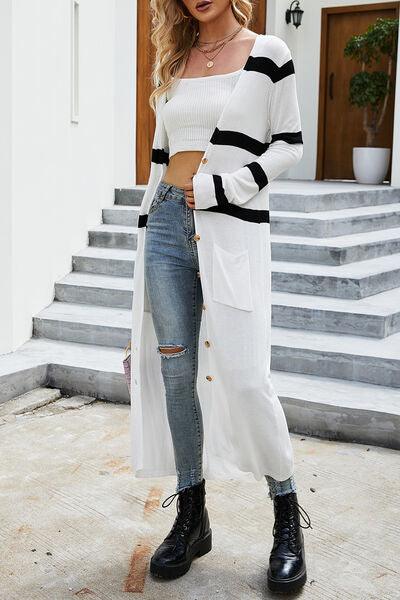 a woman wearing a white and black striped sweater and ripped jeans