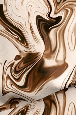 a close up of a brown and white marble