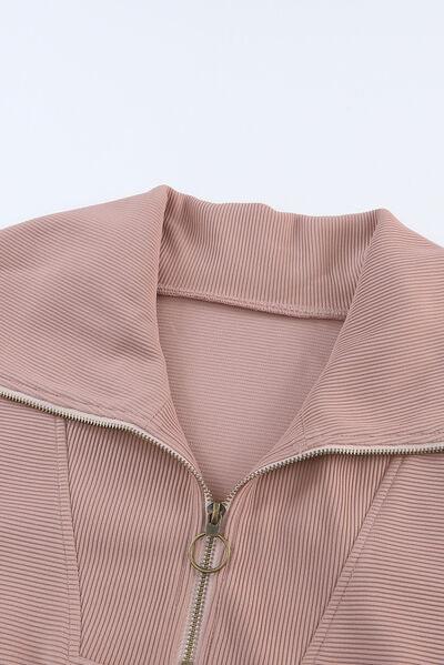 a close up of a pink jacket with a zipper