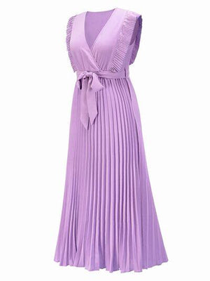 a woman wearing a purple dress with pleating
