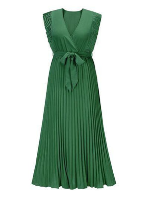 a green dress with a bow at the waist