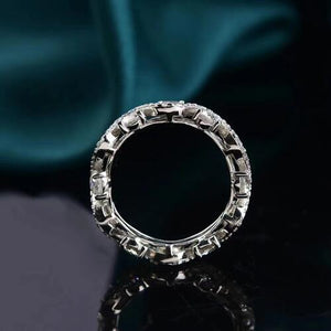 a diamond ring sitting on top of a table